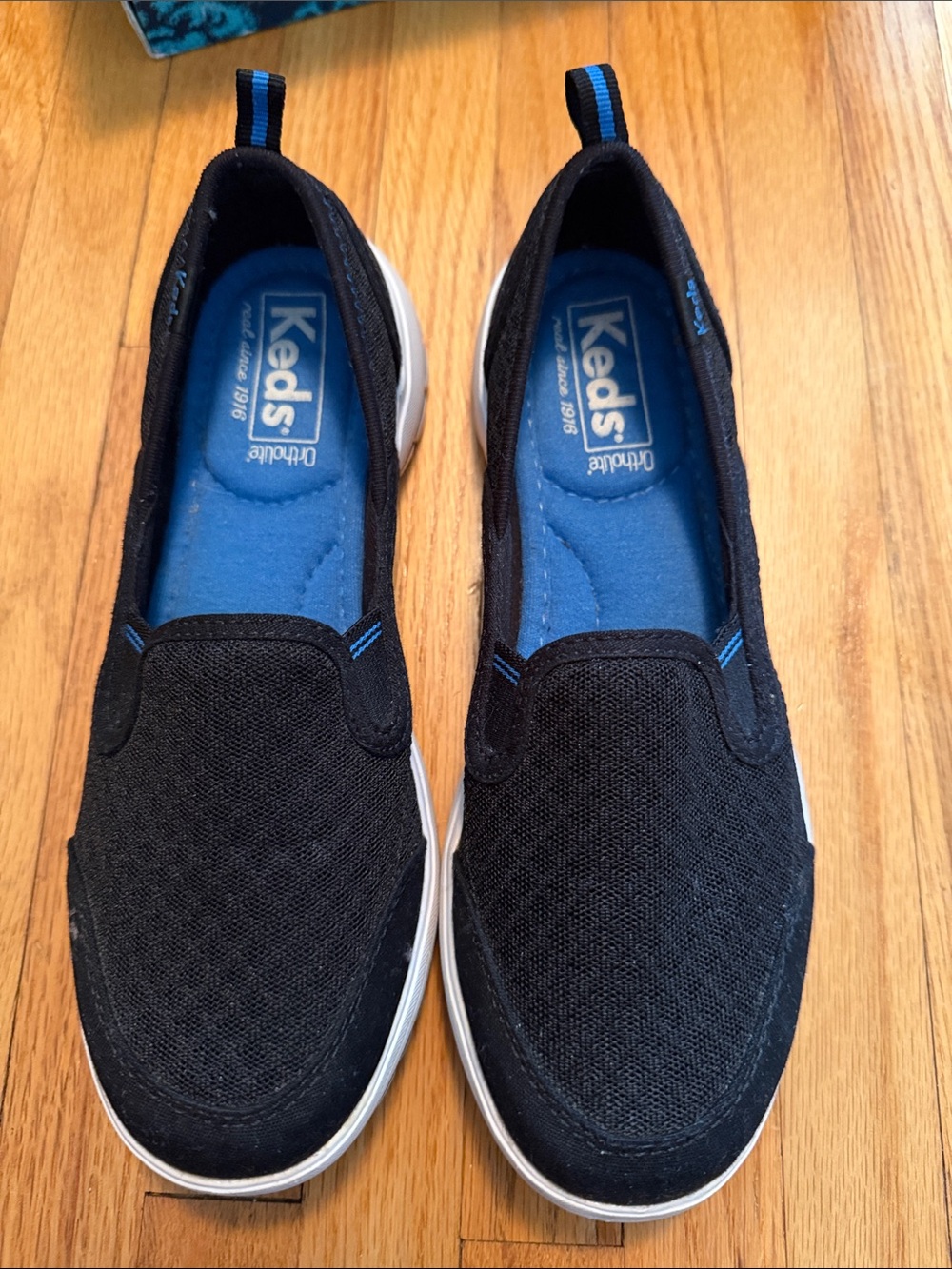 Keds Black Slip-On Sneakers with Blue Insole Accents